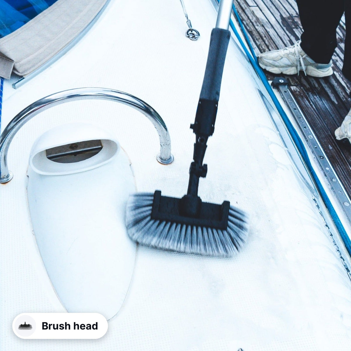 Jake brush head cleaning the deck of a sailboat
