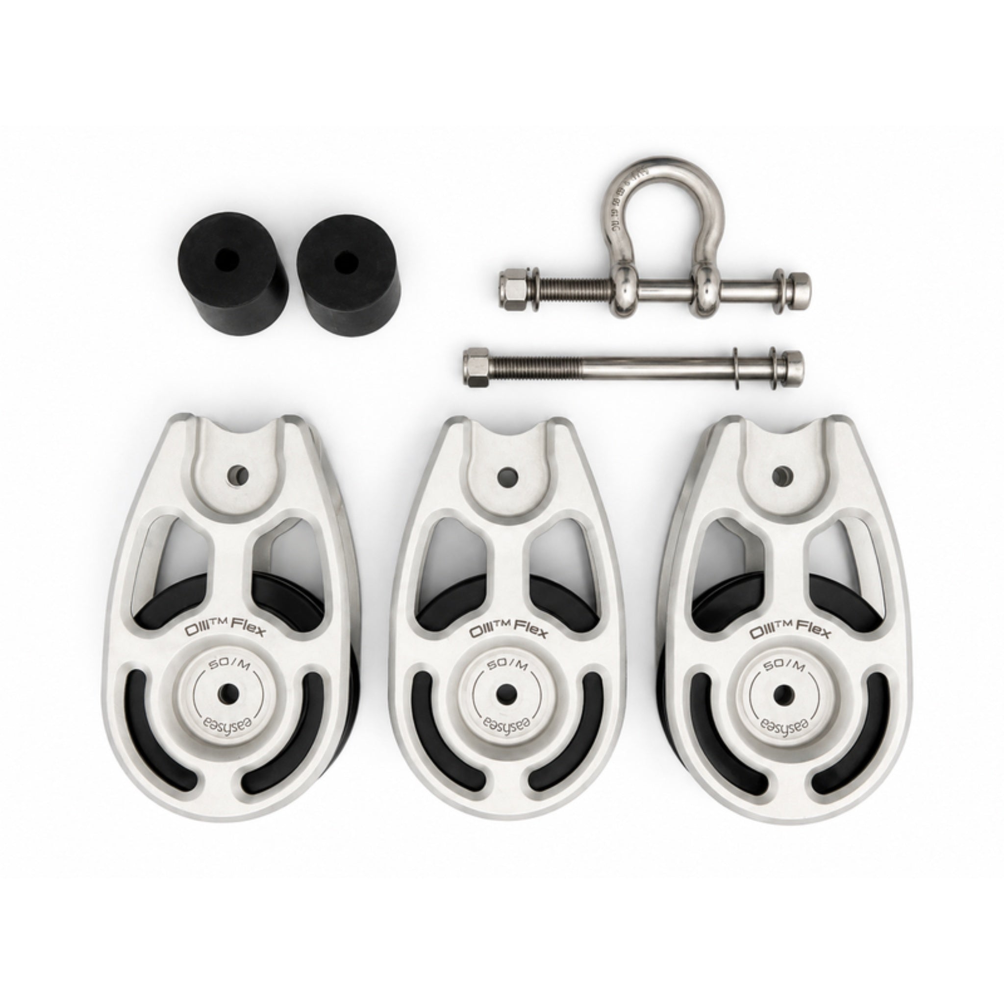 All the parts of the Olli Flex 50 M triple configuration laid out: three cheeks, two sheave spacers, the stainless shackle and the through bolts