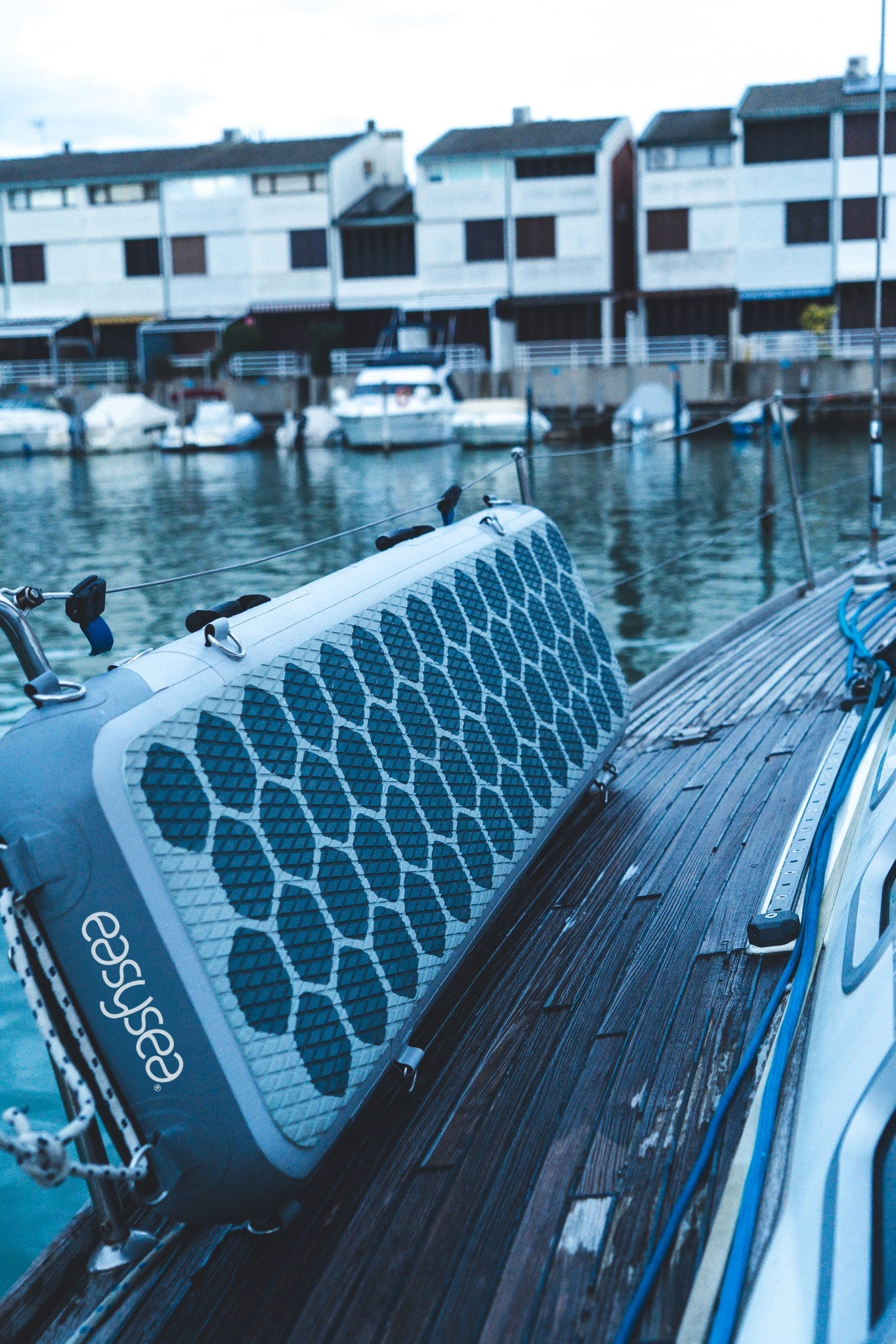 WAY2 inflatable gangway rigged alongside the hull of a sailing yacht in a marina