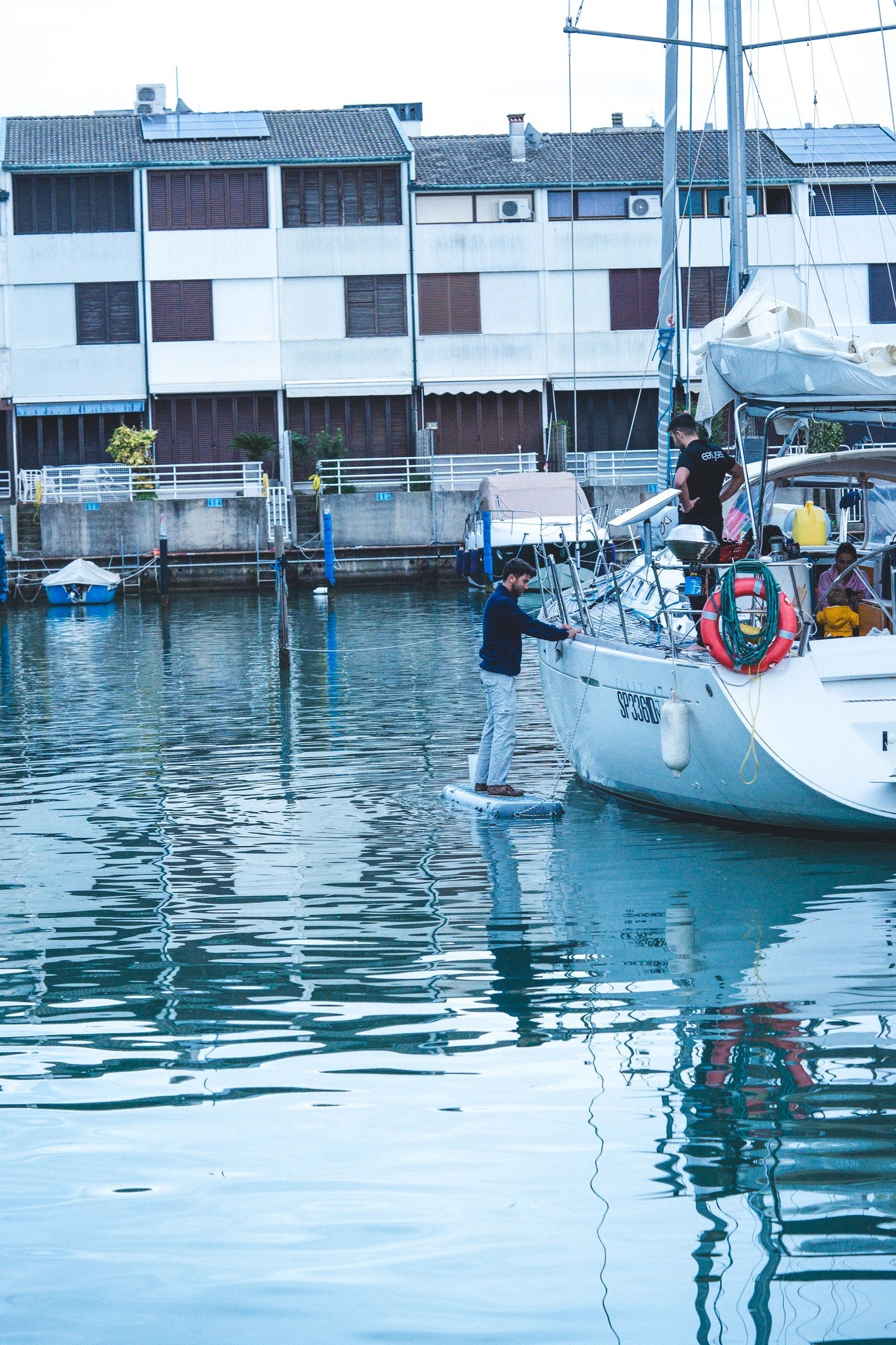 WAY2 inflatable gangway in use in a marina, from the quay to the yacht